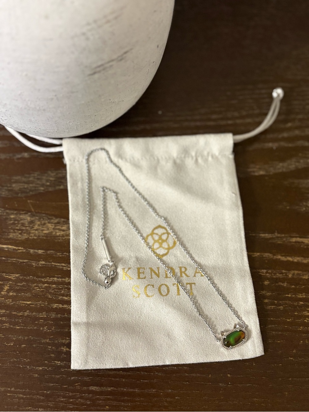 Retired Kendra Scott cat shape mood necklace.